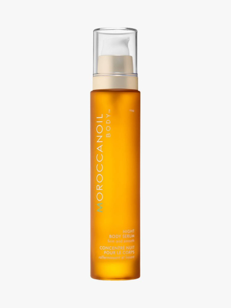 Moroccanoil Night Body Serum orange bottle of body serum on light gray background